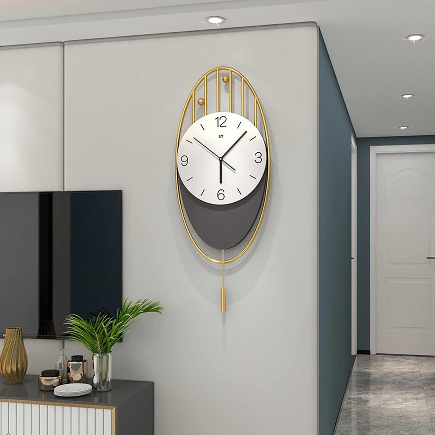 modern oval wall clock with pendulum – gold & black minimalist design